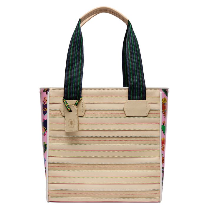 Consuela Caroline Classic Tote, front view of the cream body with colorful contrast stitching, pink heart-print side panels, and woven shoulder straps.