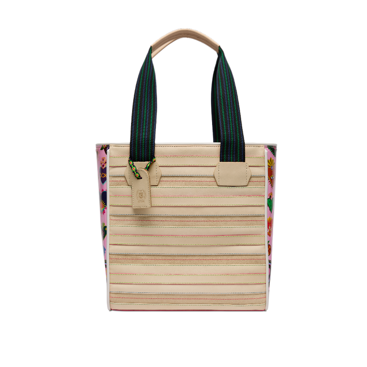 Consuela Caroline Classic Tote, front view of the cream stitched body with pink heart-print sides and woven straps on a light background.