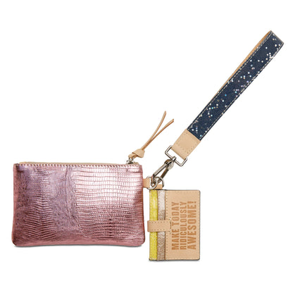 Close-up of the 5-slot pink metallic leather card organizer and natural untreated leather trim on the Elodie Combi pouch.
