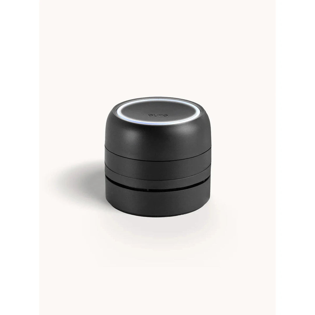 Sleek black Pura Car Pro smart diffuser for vehicles, featuring a modern, cordless design.