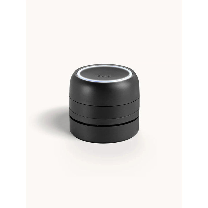 Sleek black Pura Car Pro smart diffuser for vehicles, featuring a modern, cordless design.