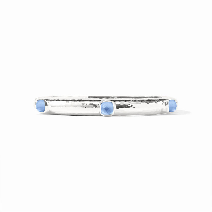 Julie Vos Catalina Stone Hinge Bangle in silver featuring Iridescent Chalcedony Blue glass end caps and a hand-hammered texture.