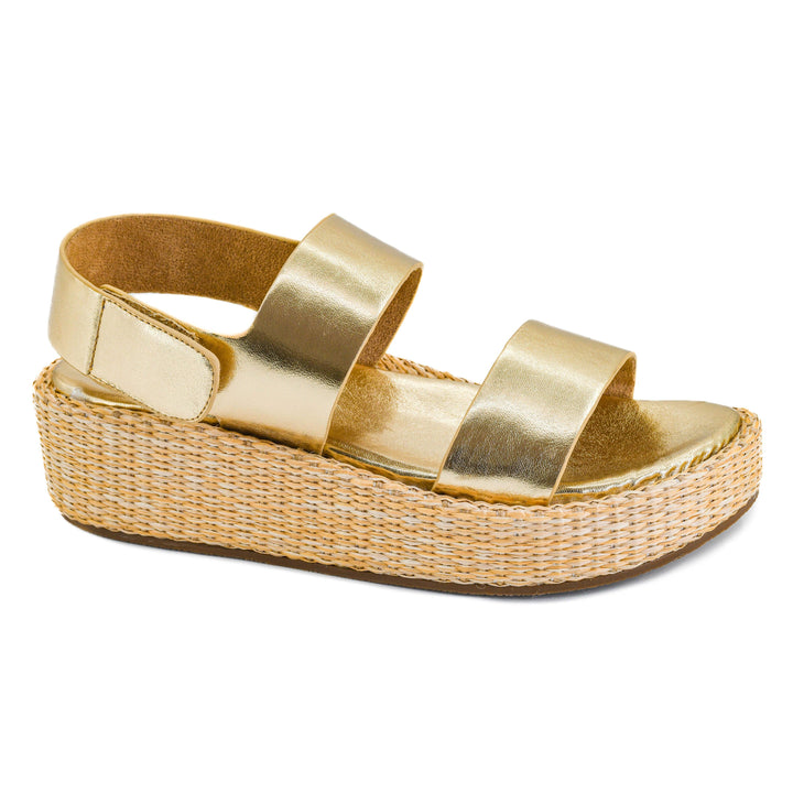 Corkys Heatwave Gold platform sandal showcasing its metallic gold straps, adjustable ankle buckle, and thick textured raffia-wrapped woven sole.