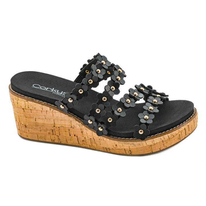 Corkys Lets Be Friends wedge sandal in classic black showcasing its dimensional 3D floral multi-straps and high cork textured heel.