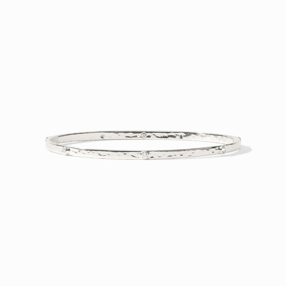 Close-up of the Julie Vos hallmark and the sleek silver profile of the Crescent Stone Bangle.