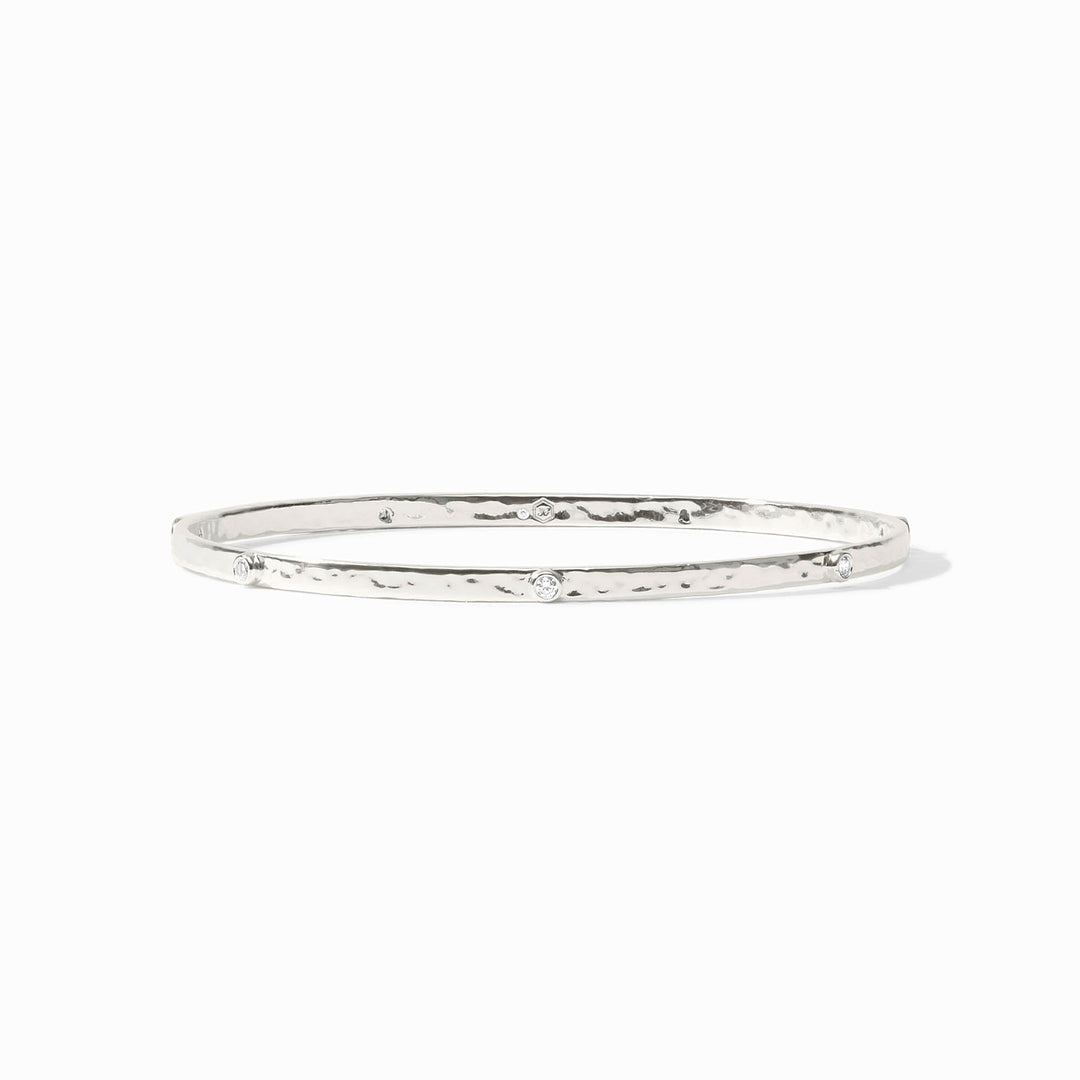 Close-up of the Julie Vos hallmark and the sleek silver profile of the Crescent Stone Bangle.