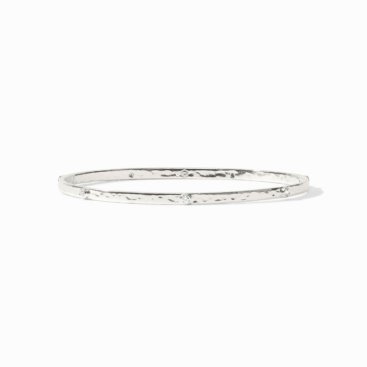 Close-up of the Julie Vos hallmark and the sleek silver profile of the Crescent Stone Bangle.