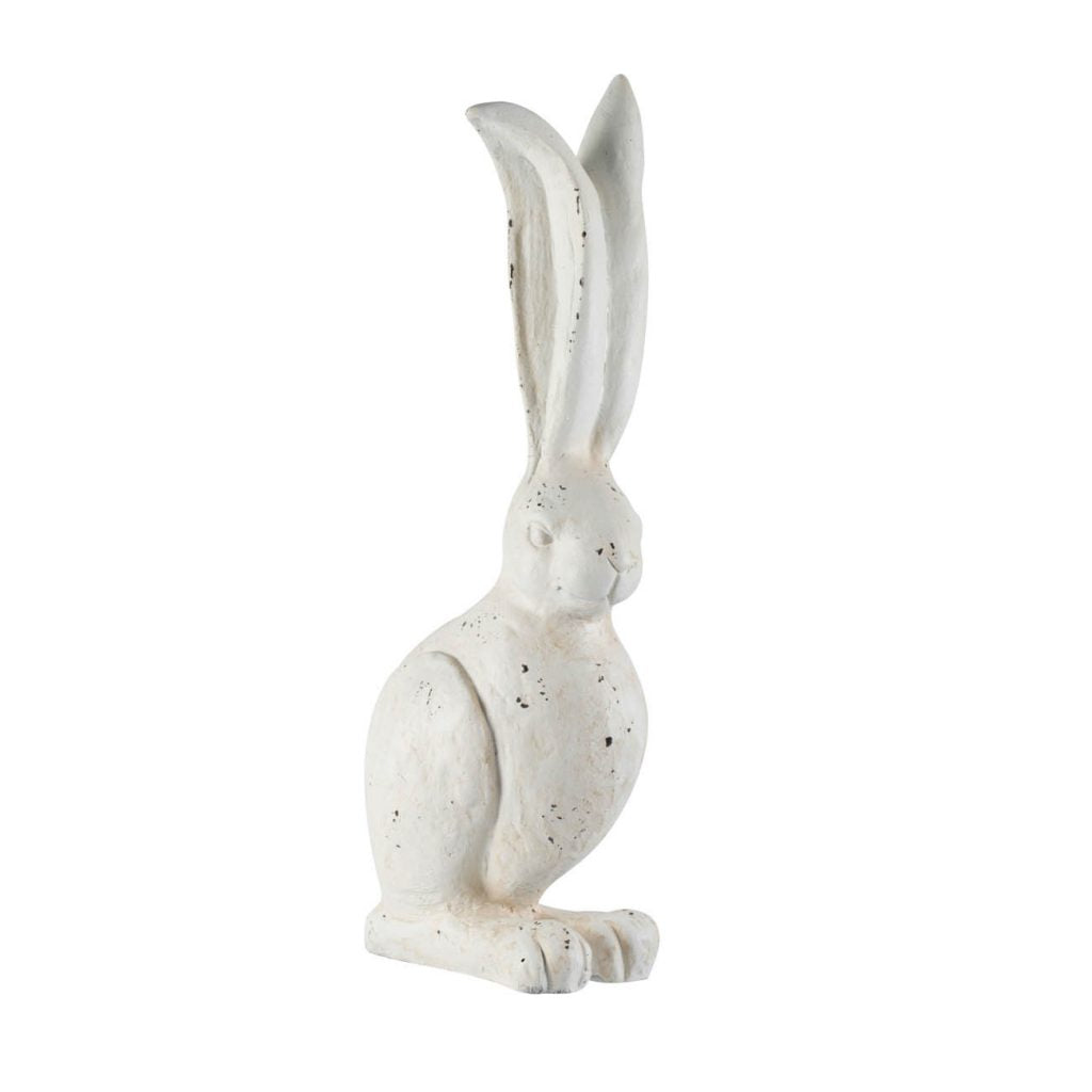 White rabbit figurine on a white background