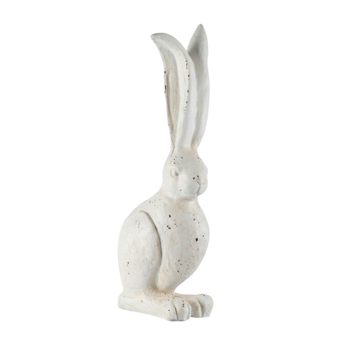 White rabbit figurine on a white background
