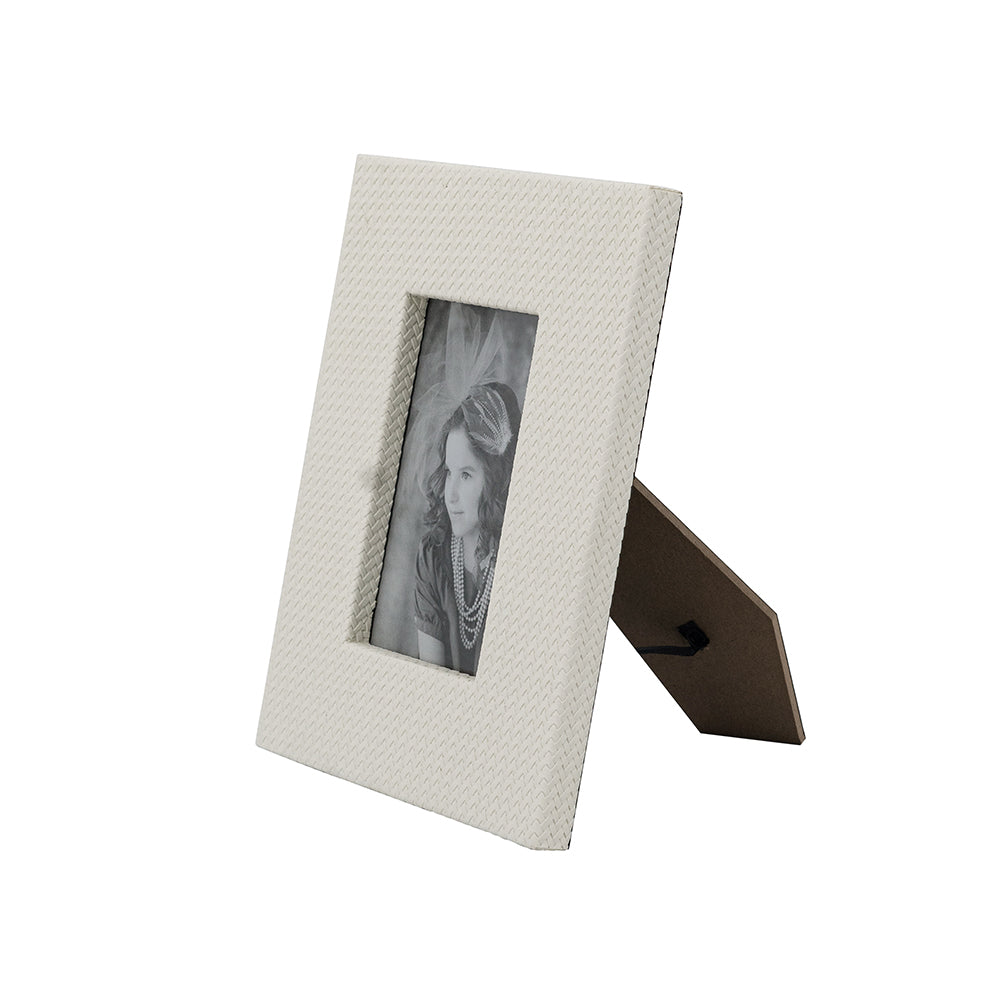 White textured picture frame with a portrait inside on a white background