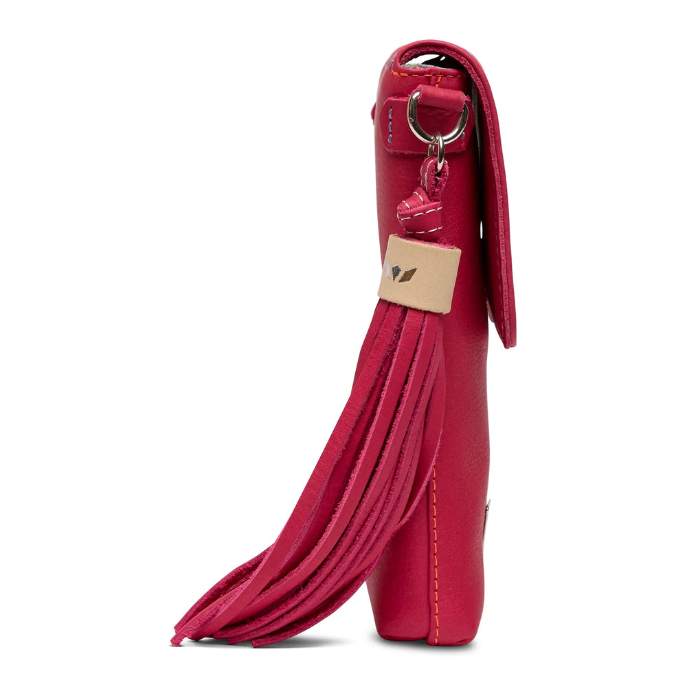 Close-up of the long pink leather tassel and silver hardware on the Maren Dash Crossbody.