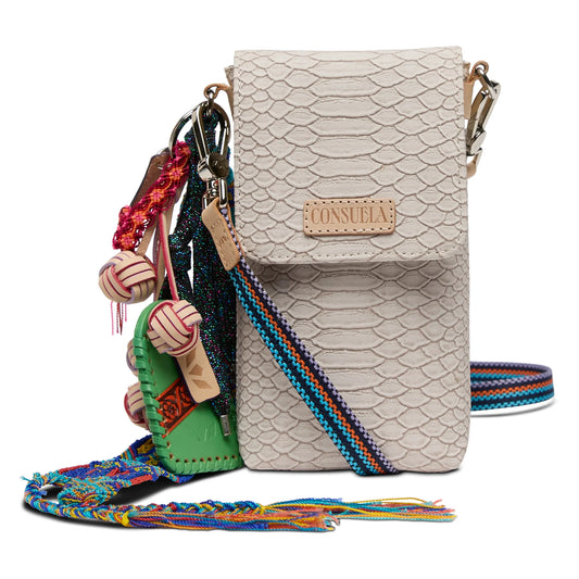 Consuela Thunderbird Dash Crossbody featuring multi-colored Thunderbird embroidery on neutral leather with an oversized tassel.