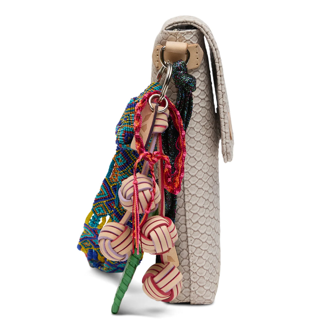 Close-up of the intricate Thunderbird embroidery and natural untreated leather trim on the Consuela Dash Crossbody.