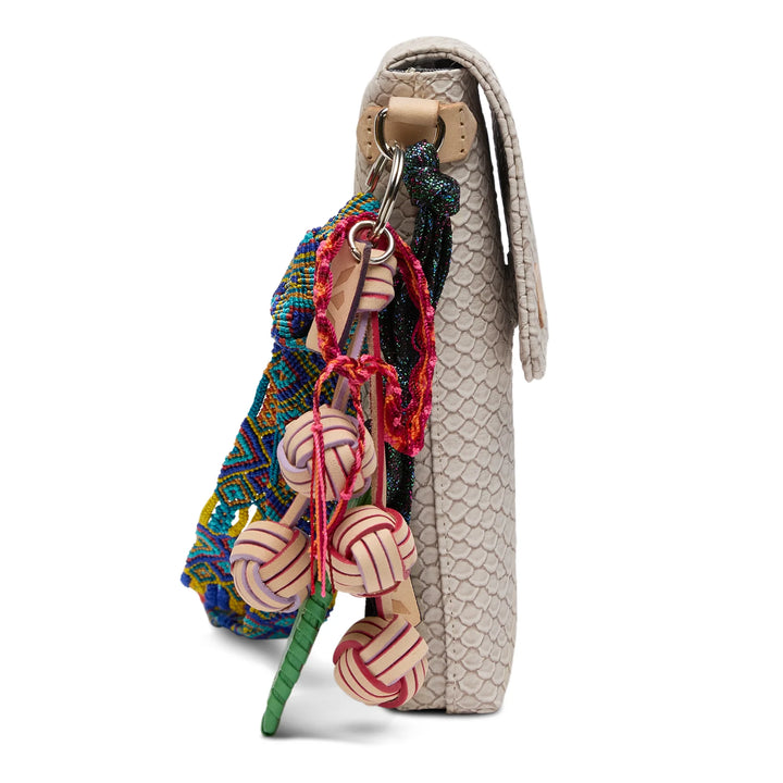 Close-up of the intricate Thunderbird embroidery and natural untreated leather trim on the Consuela Dash Crossbody.