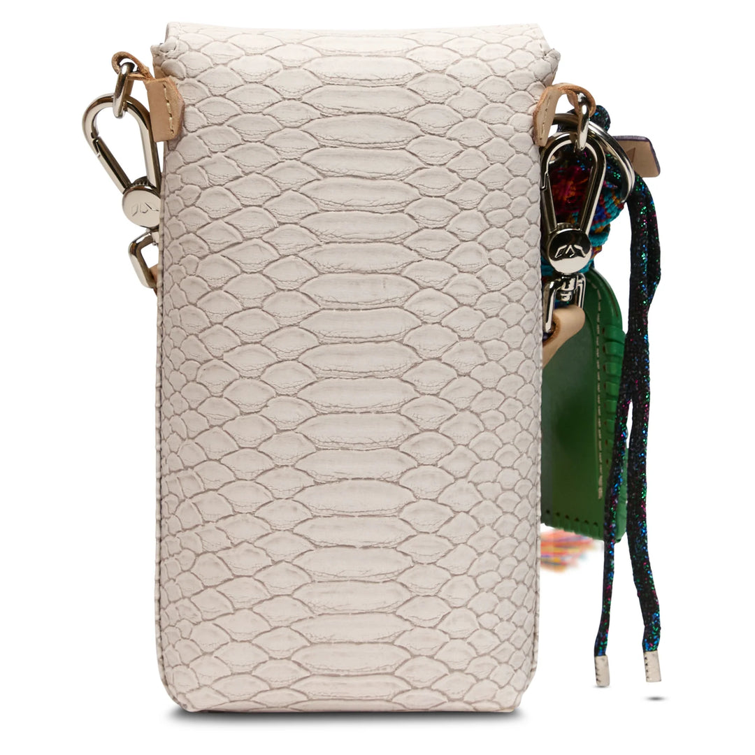 Back of the Thunderbird Dash bag showing the natural leather exterior slide pocket and adjustable woven strap.