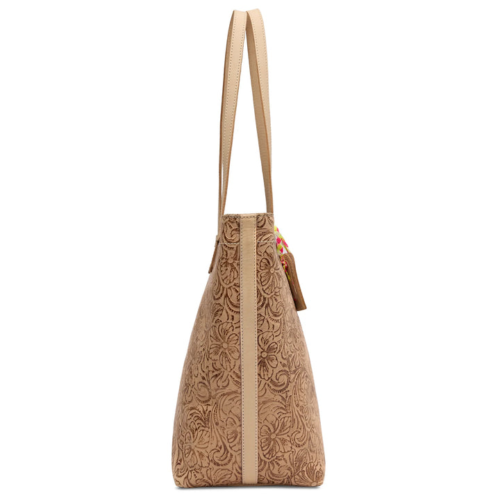 Side profile of the structured Lawton Daily Tote showing the wide base and natural leather side anchors.