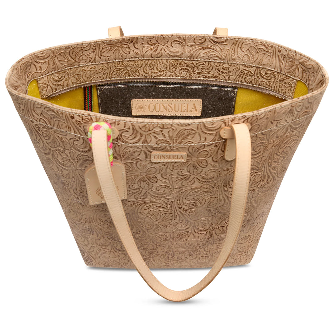 Close-up of the natural untreated leather handles and silver-tone hardware on the Lawton tote.