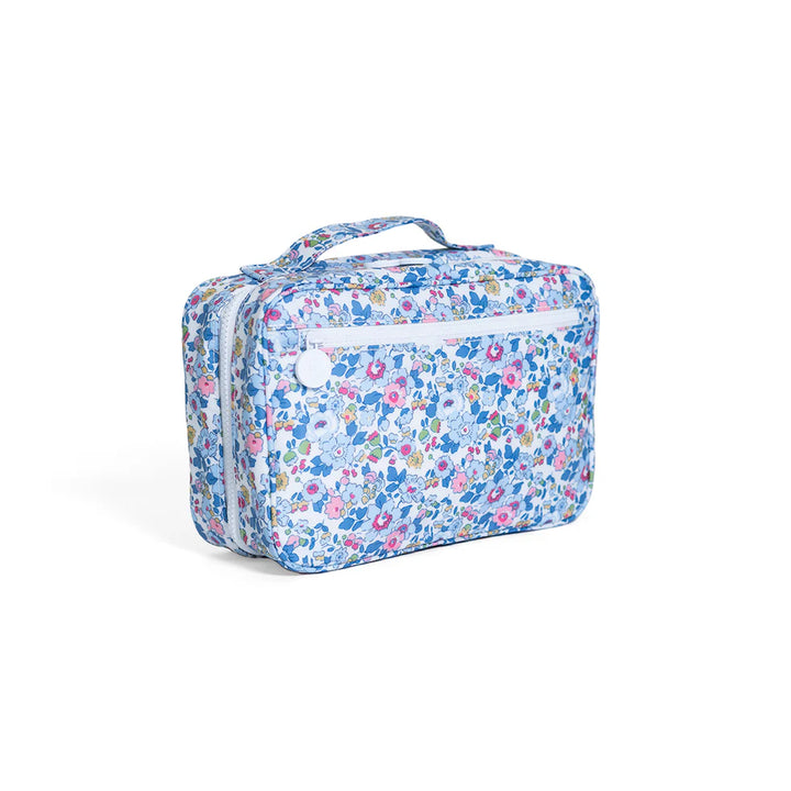 Foldable hanging toiletry bag in blue and white Bridgehampton Floral print with a white chunky zipper.