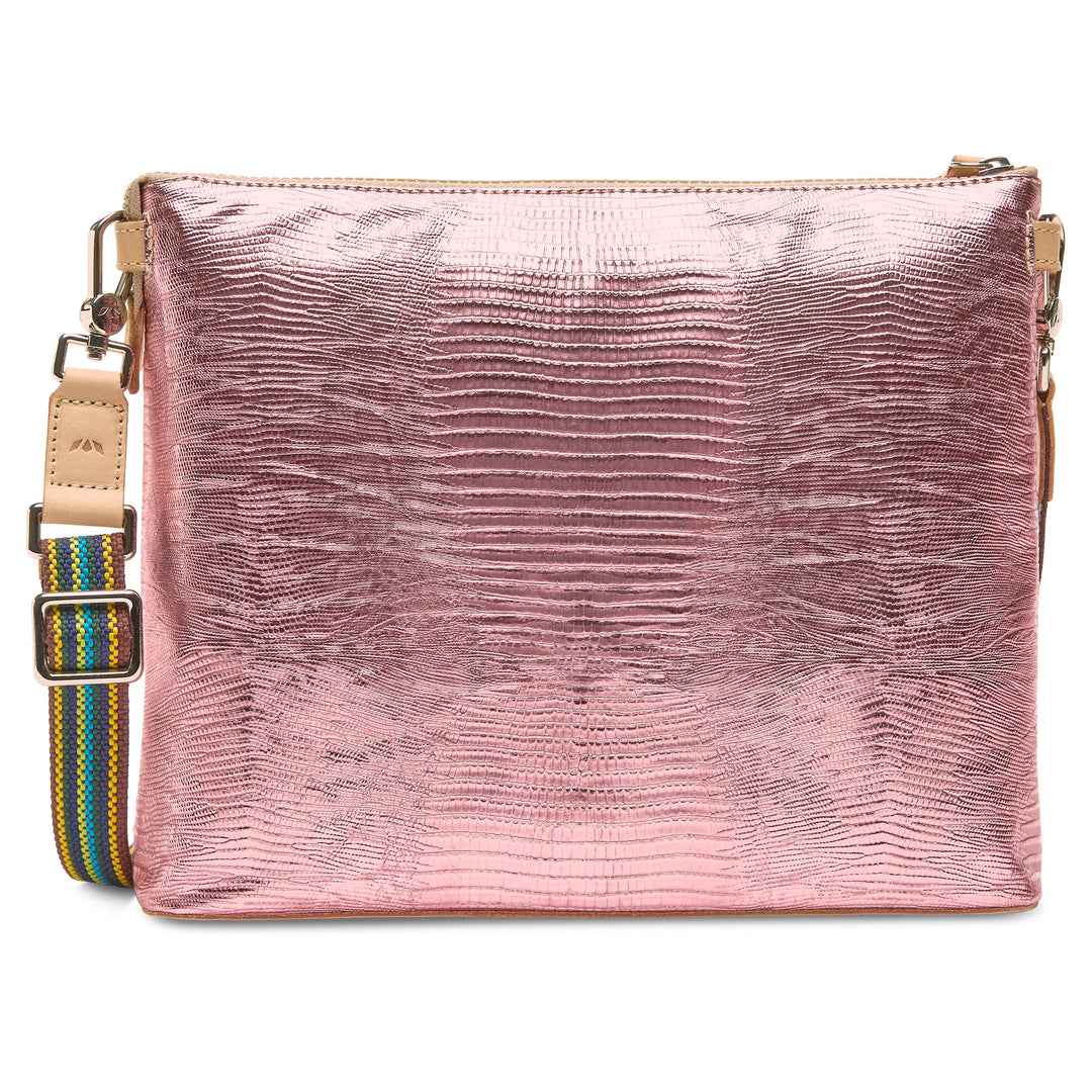Side profile of the Elodie bag highlighting the 3-inch depth and snake-print texture.