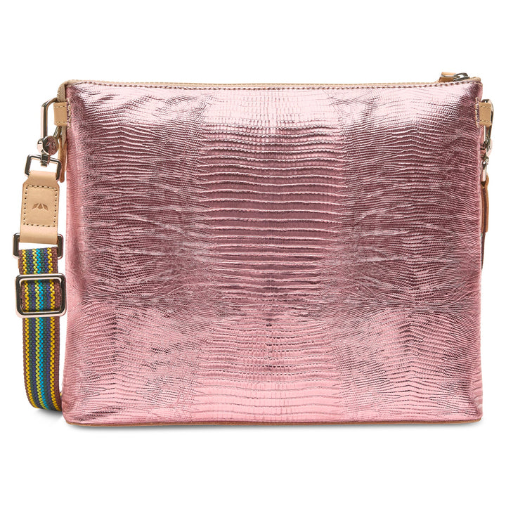 Side profile of the Elodie bag highlighting the 3-inch depth and snake-print texture.