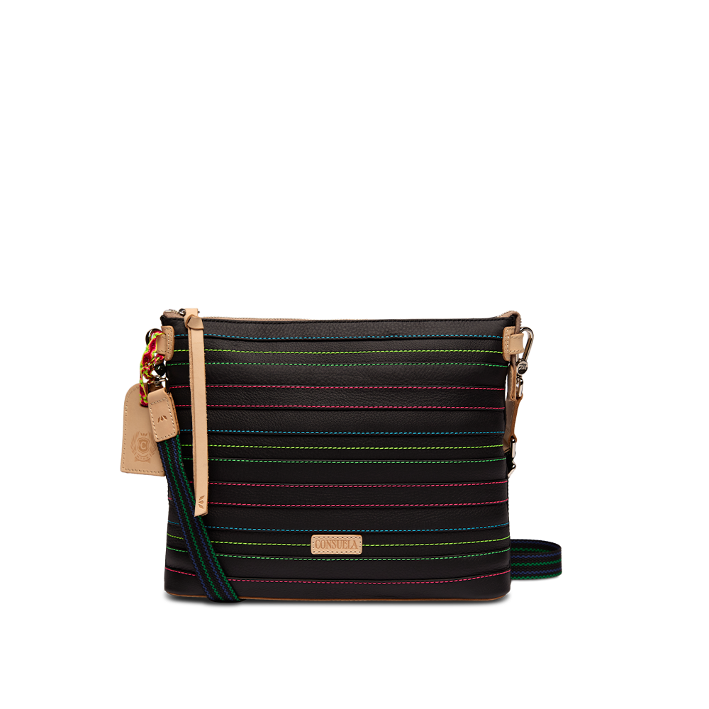 Consuela Ray Downtown Crossbody in black leather with multi-color stitching, front view with an adjustable woven strap draped to the side.