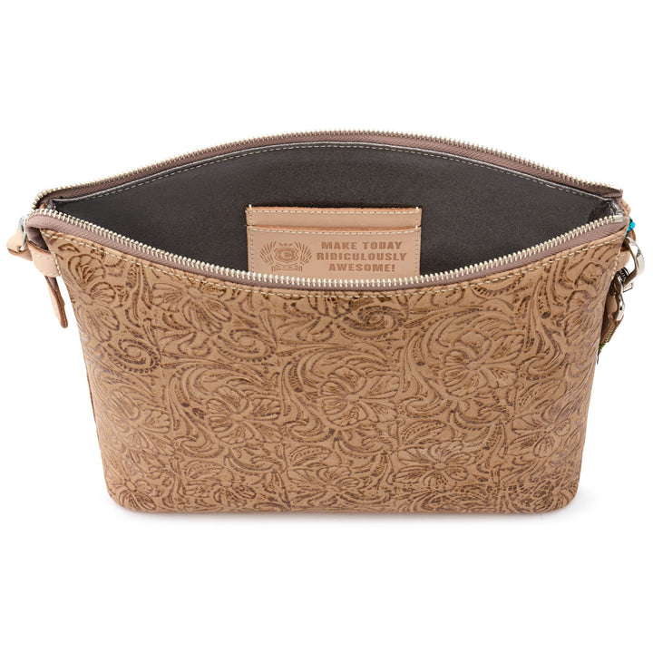 Open-top view of the Consuela Lawton Downtown Crossbody with an interior leather card pocket stamped Make Today Ridiculously Awesome.