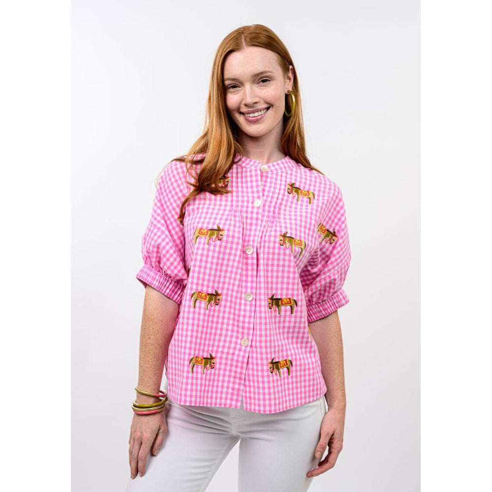 Close-up of the pink check fabric and donkey motif on the Sister Mary peasant blouse.