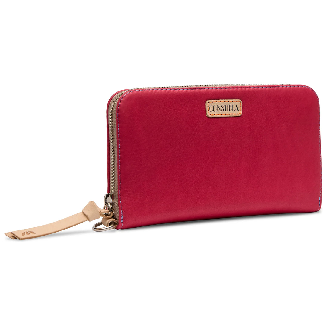 Close-up of the natural untreated leather trim and the D-ring attachment on the pink Maren wallet.
