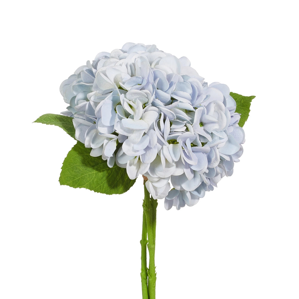 Artificial blue hydrangea flower arrangement with green leaves on a white background