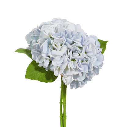Artificial blue hydrangea flower arrangement with green leaves on a white background
