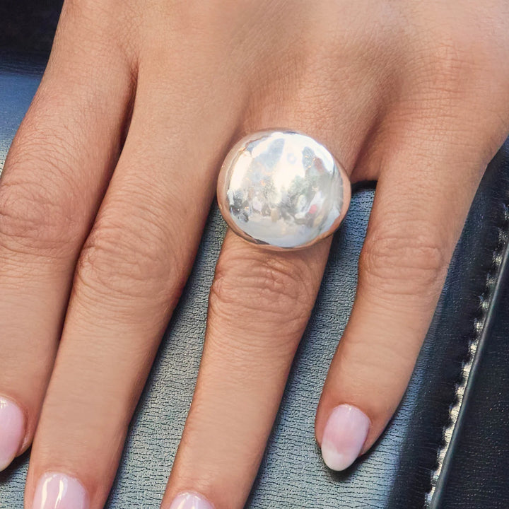 Close-up of the hand-hammered texture on the Solara Silver Ring highlighting the organic shimmer.

Lifestyle View: The Solara Hammered