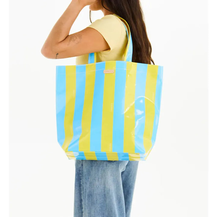 Close-up of the Surfside striped pattern and Diego natural leather logo accent on the Consuela Basic Bag.