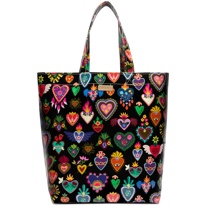 Consuela Vida Grab n Go Basic tote standing upright, full front view of colorful sacred-heart designs on glossy black with top handles for shoulder or hand carry.