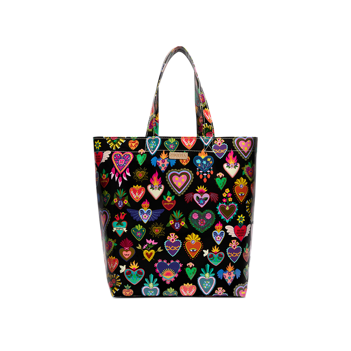 Consuela Vida Grab n Go Basic tote in glossy black, covered front-on with a colorful Mexican folk-art sacred-heart print, tall top handles, and a Consuela leather logo tab.