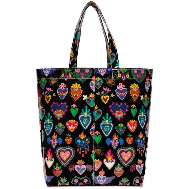 Front panel of the Consuela Vida black tote featuring vibrant embroidered-style hearts, flowers, and flames with sturdy carry handles.