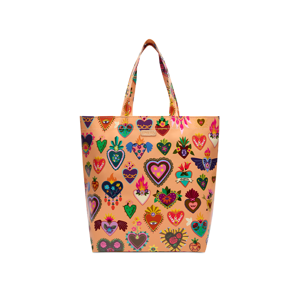 Consuela Peach Grab n Go Basic tote standing upright, full front view of colorful heart print on a soft peach base with top handles.