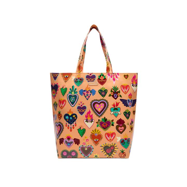 Consuela Peach Grab n Go Basic tote standing upright, full front view of colorful heart print on a soft peach base with top handles.