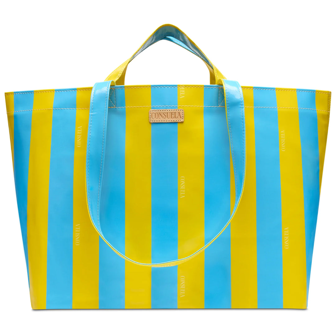 Consuela Surfside Grab 'n' Go Jumbo bag with bold blue and yellow vertical stripes and dual sets of handles.