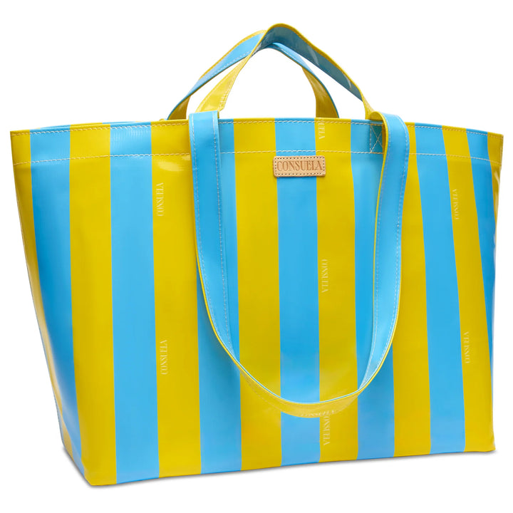 Close-up of the Surfside striped ConsuelaCloth pattern and Diego natural leather logo accent.