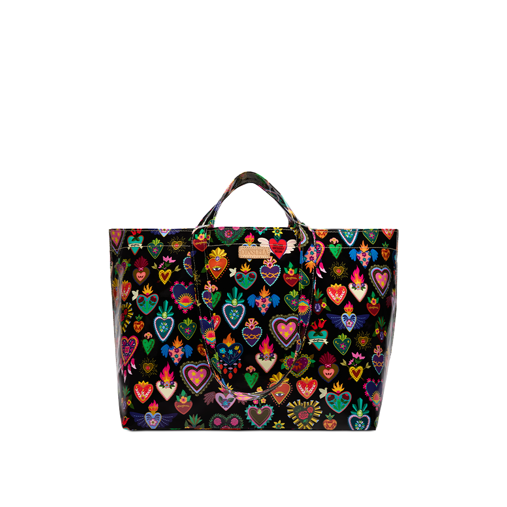 Consuela Vida Grab n Go Jumbo tote standing upright with an open, roomy top and colorful heart print on a glossy black base.