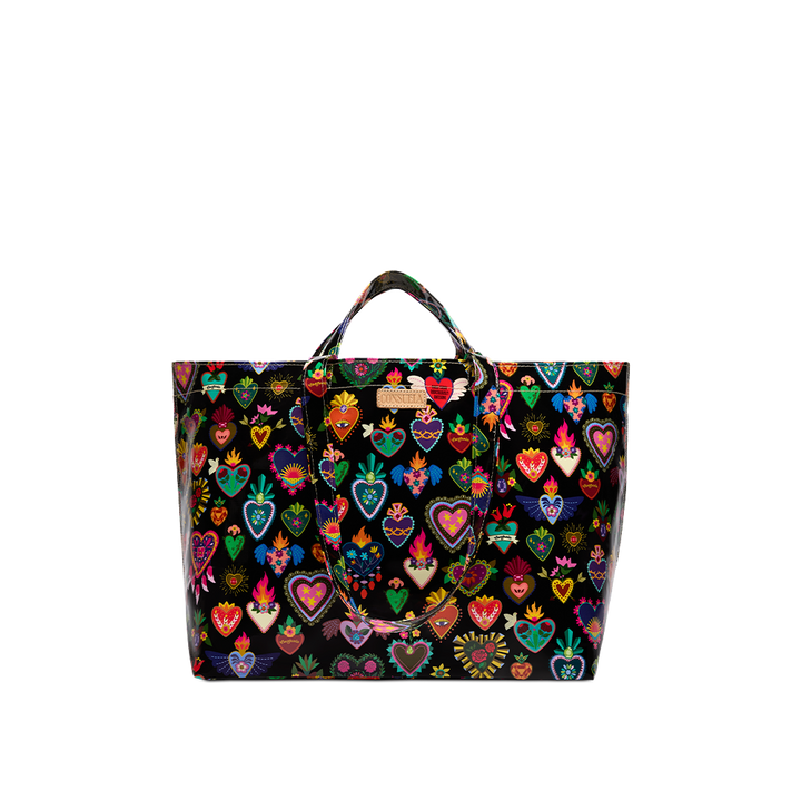 Consuela Vida Grab n Go Jumbo tote standing upright with an open, roomy top and colorful heart print on a glossy black base.