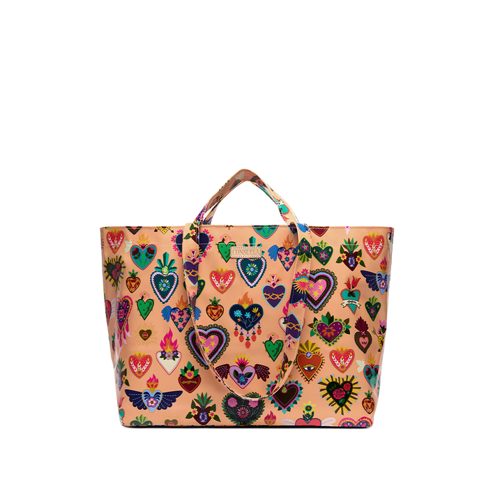 Consuela Peach Grab n Go Jumbo tote standing upright with an open, roomy top, glossy peach exterior, and colorful sacred-heart designs.