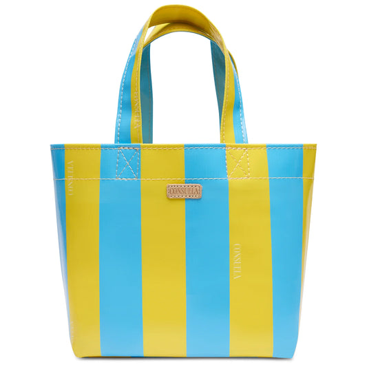 Consuela Surfside Grab 'n' Go Mini bag with bold blue and yellow vertical stripes and natural leather handles.