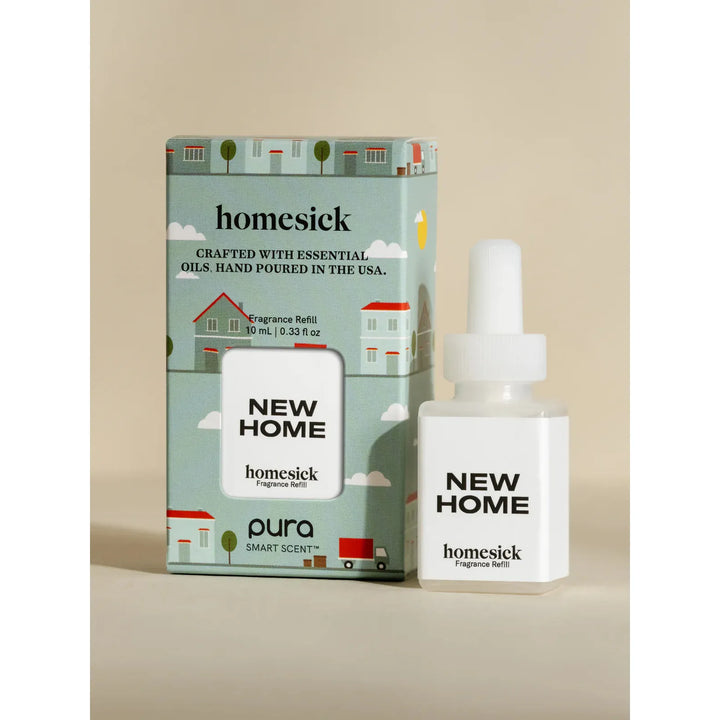 Pura smart fragrance vial in New Home by Homesick, featuring a minimalist label with "New Home" typography.