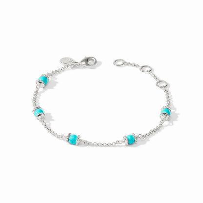 Close-up of the silver Hydra bracelet with a turquoise stone and the silver-tone lobster clasp.