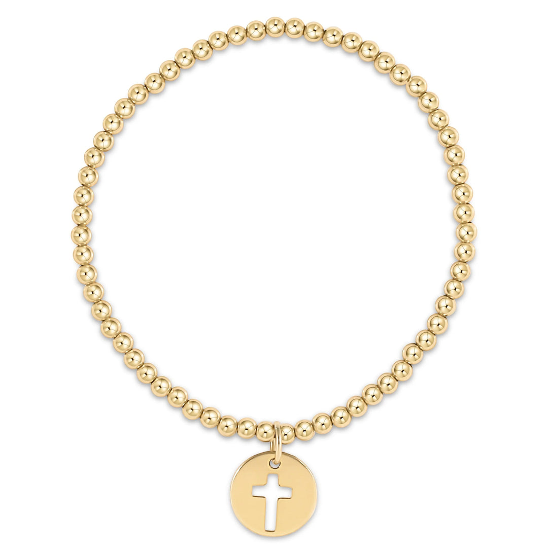 enewton 3mm gold-filled beaded bracelet with an cross cutout gold disc charm; waterproof and tarnish-resistant.
