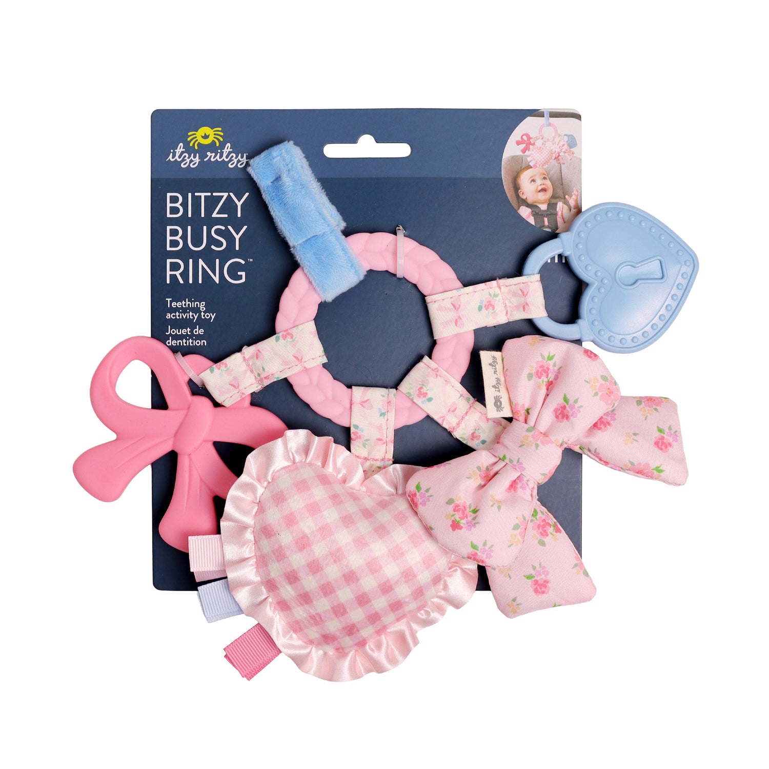 Itzy Ritzy Bow Bitzy Busy Ring sensory travel toy with textured teethers and dangling crinkle toys attached to a stroller bar.