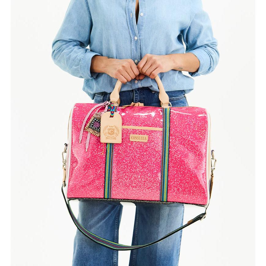 Consuela Bae Jetsetter duffel bag featuring a multicolored glitter exterior and natural leather handles.