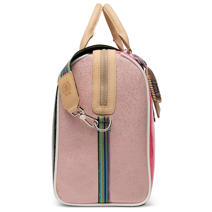 Consuela Bae Jetsetter duffel bag featuring a multicolored glitter exterior and natural leather handles.
