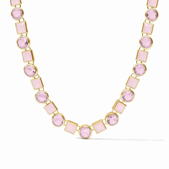 Necklace with pink gemstones and gold accents on a white background